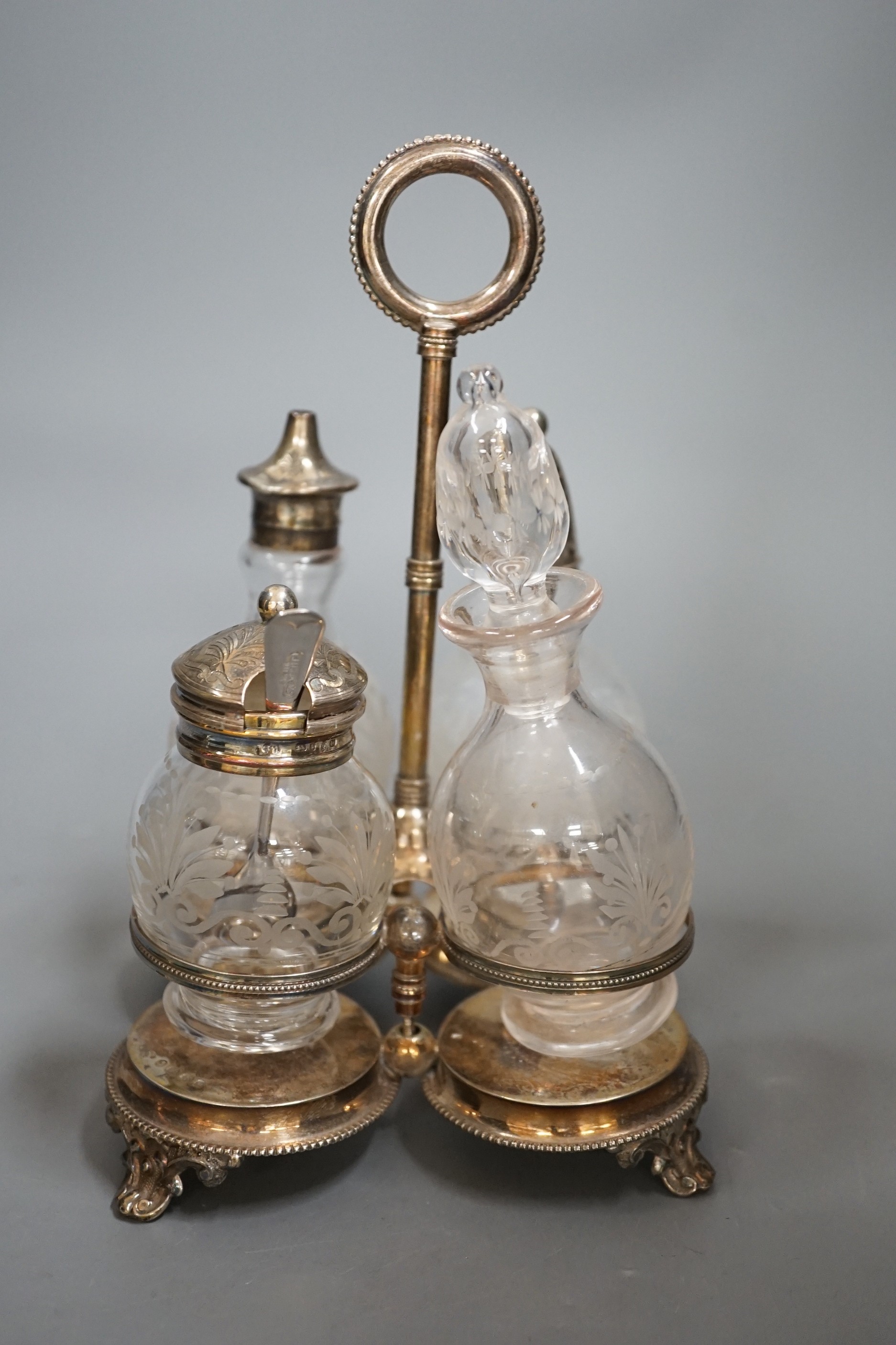 A Victorian silver 4 bottle cruet stand, Hilliard & Thomasson?, Birmingham, 1876, height 20.5cm, with ring handle.